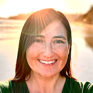 Closeup of Nathalie Delherbe at beach.