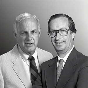 Old grayscale photo of Roger Carpenter and Theodore Cohn in suits