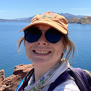 Closeup of Yazmin Lommel outsdie with lake in background.