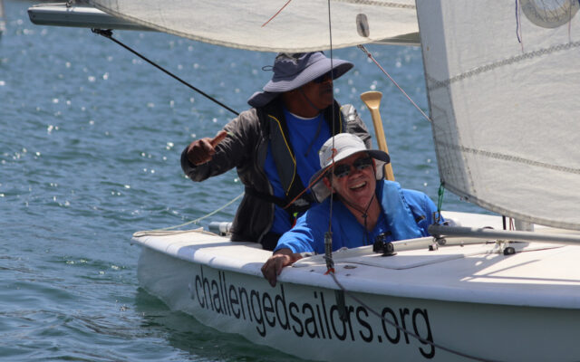 Peter Phillips in small sailboat in ocean.